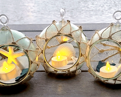 Blog idea: 3 nautical hanging luminaries made from plastic terrarium globe, twine, tea light candle, sand, nautical decorations, and more