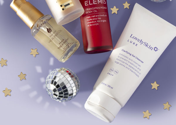 Featuring products from Kate Somerville, L'ANZA, ELEMIS, LovelySkin LUXE & ISDIN laying flat with New Year's Day decor