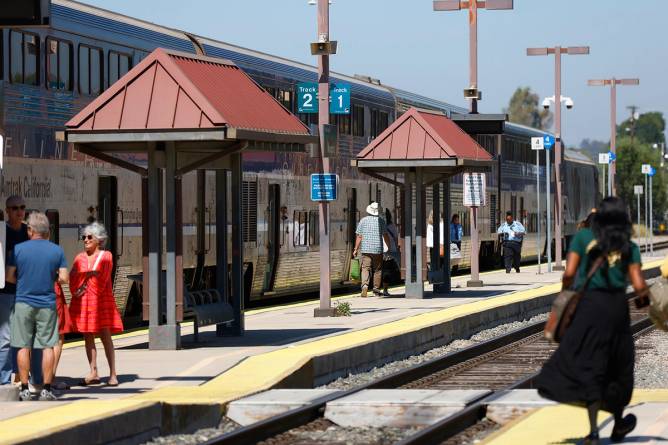 People waiting to board Amtrak trains