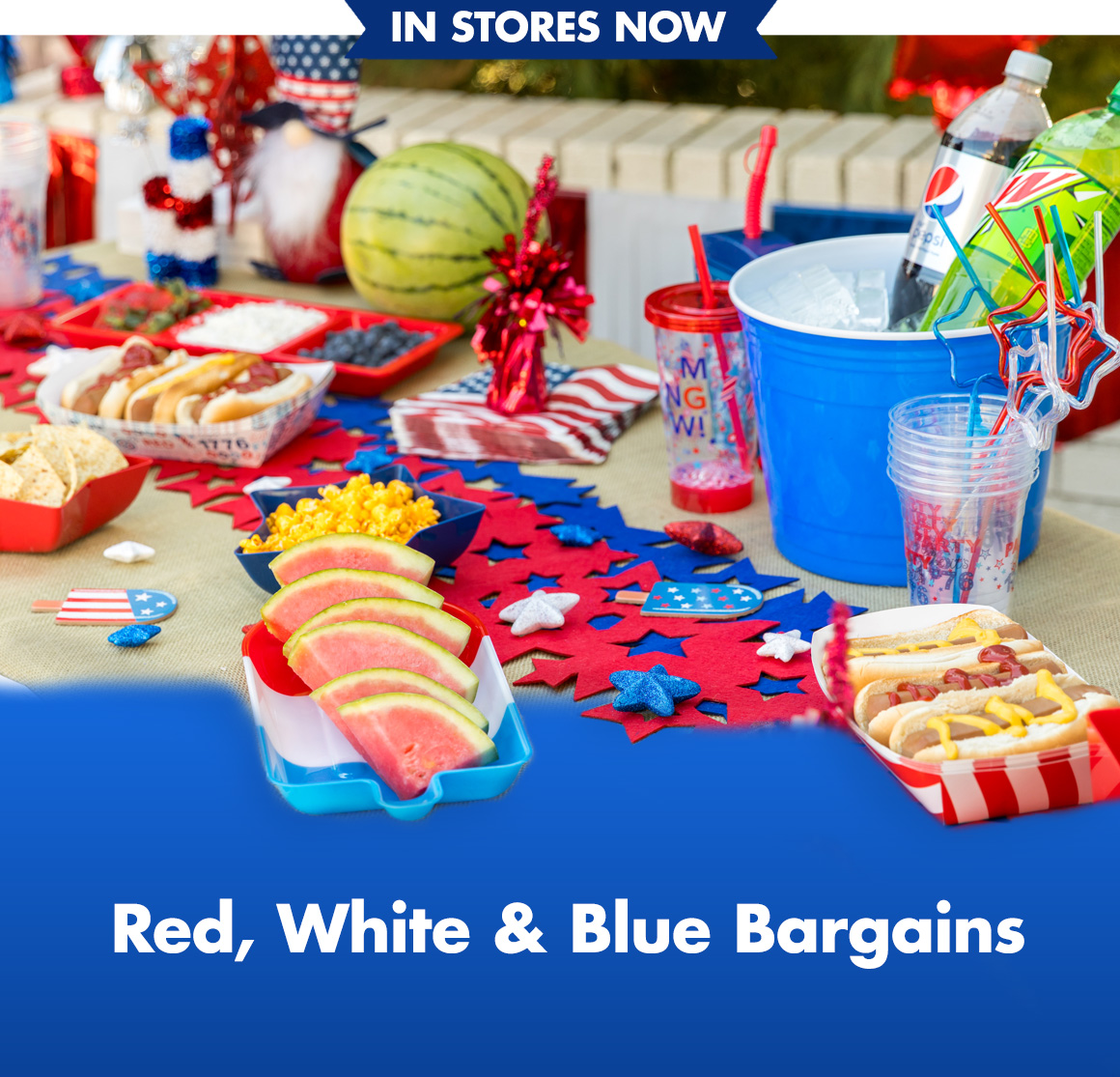 Table of red, white, and blue decorations, food, drinks, and more