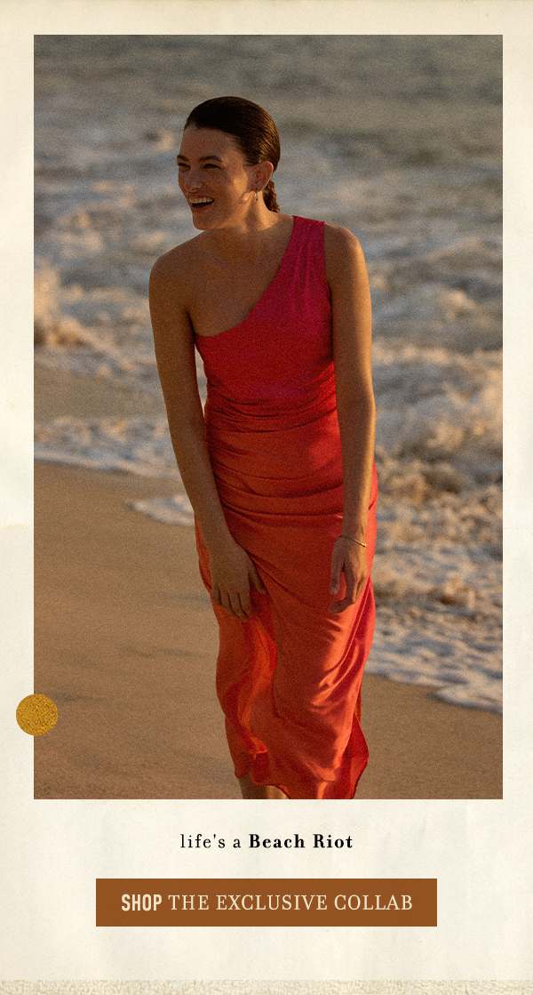 Woman wearing red one-shoulder dress. Shop Beach Riot.