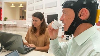 A panelist monitored during electroencephalogram recording at the International Coffee Tasting Summer Session at the Mumac Academy, Milan, Italy, July 2022.