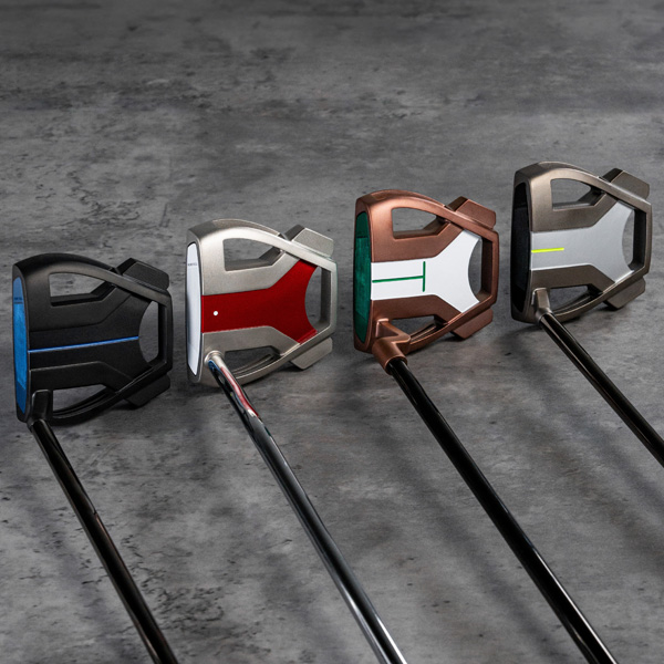 4 different colorways and finishes of Myspider Tour x putters in a studio setting, showing the top of the putters