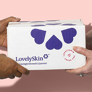 Hands holding LovelySkin shipping box