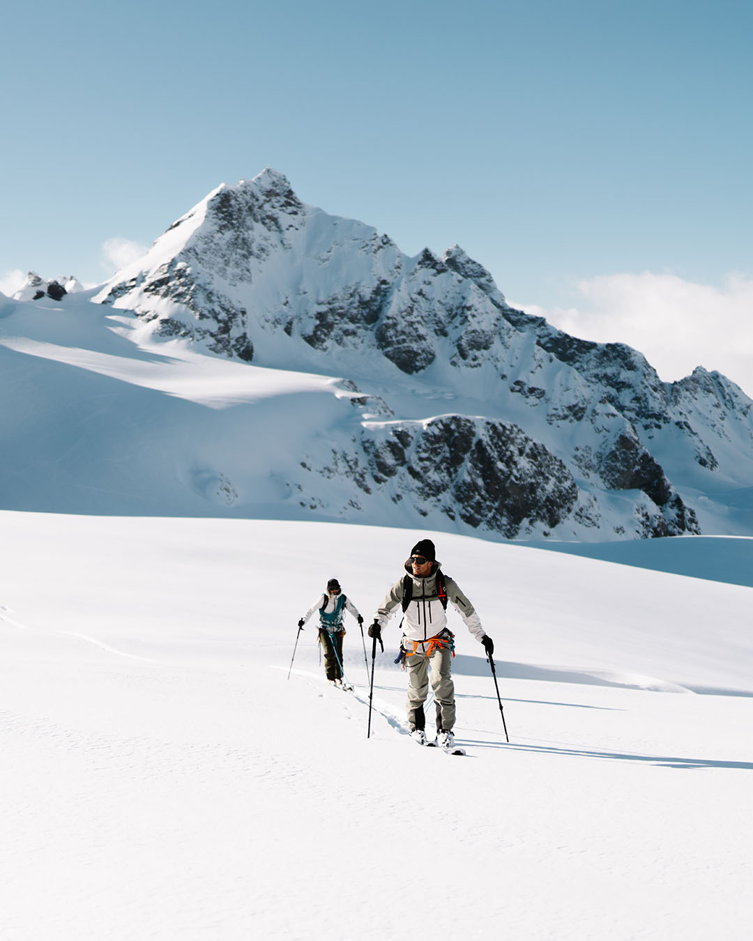 Two people enjoying a ski touring adventure in the mountains