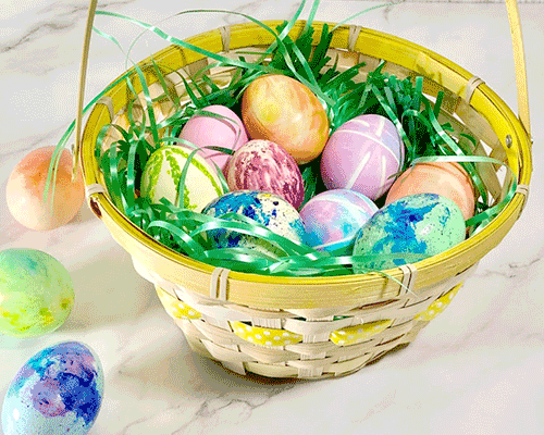 Blog idea: 6 Easter egg dyeing ideas showing a basket of different colored eggs