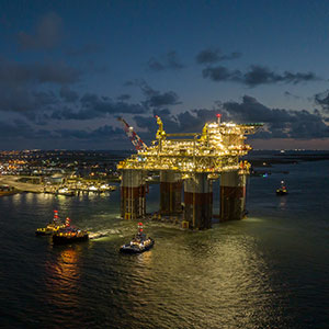 an oil rig platform over the water