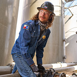 a chevron worker tightening a gas pipe