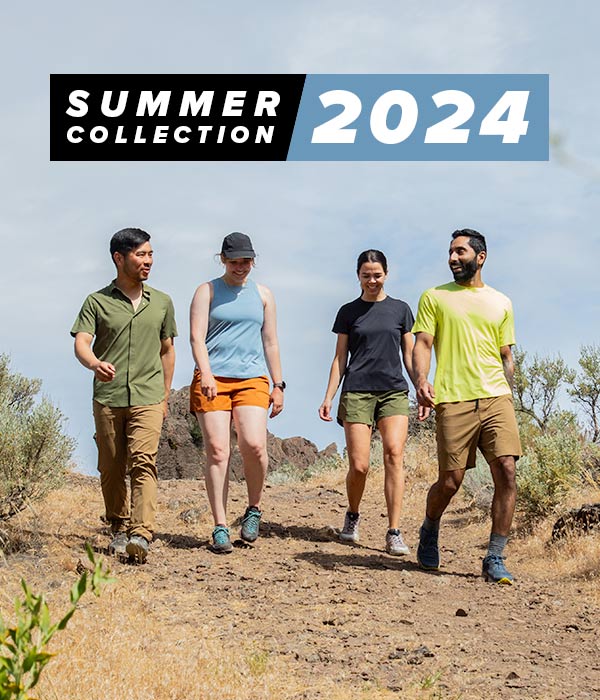 2 men and 2 women hiking on a high desert trail with brush on the sides. Wearing items from the new Summer 2024 collection including the FirstSun shirt, Feathers Tech-T and Tank and the SolarSwift Short  Sleeve Tech-T