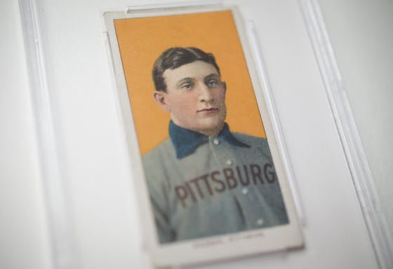 The famous "T-206" Honus Wagner baseball card is displayed in a glass case