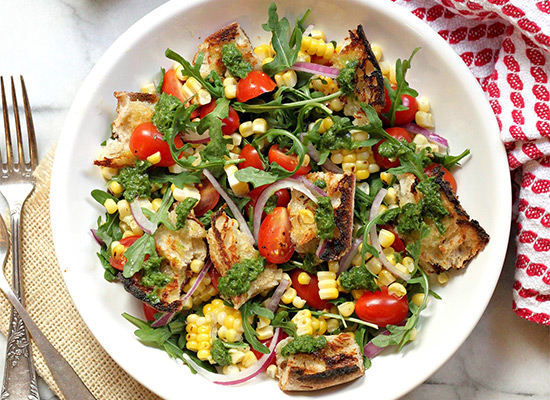 See the Grilled Bread Salad with Charred Corn, Tomatoes, Red Onion, Basil Vinaigrette recipe