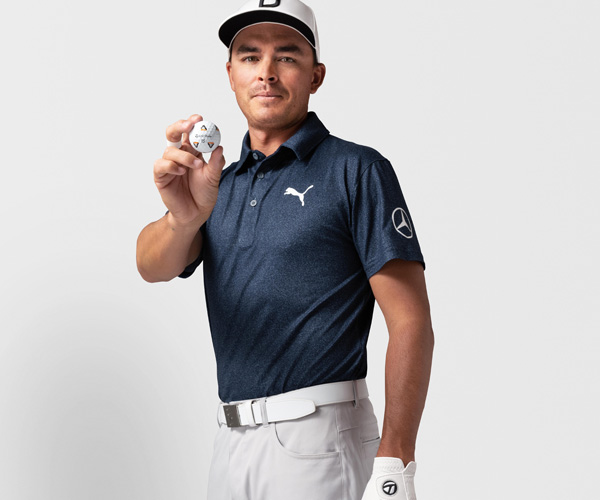 Rickie Fowler holding a TP5 Pix golf ball