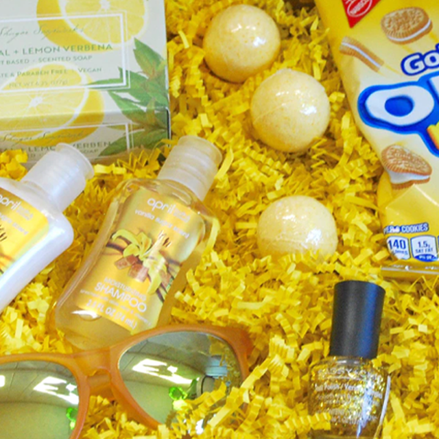 Blog idea: sunshine-themed gift box filled with yellow shreds, sunglasses, nail polish, bath bombs, and more