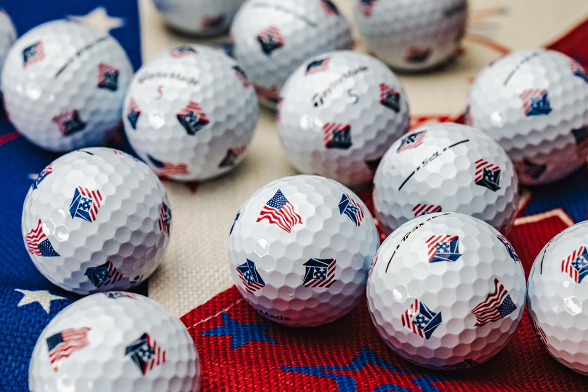 TP5 and TP5x pix USA golf balls on top of a red, white and blue star table cloth