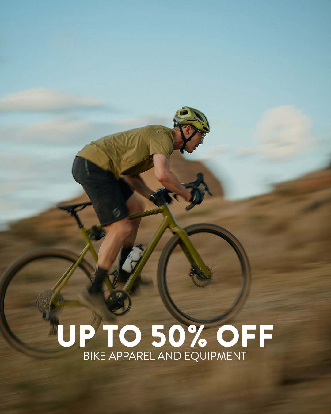 A man riding with a SCOTT gravel bike on a mountain