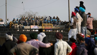 Protesting farmers face a police barricade near Shambhu, India, Feb.16, 2024.