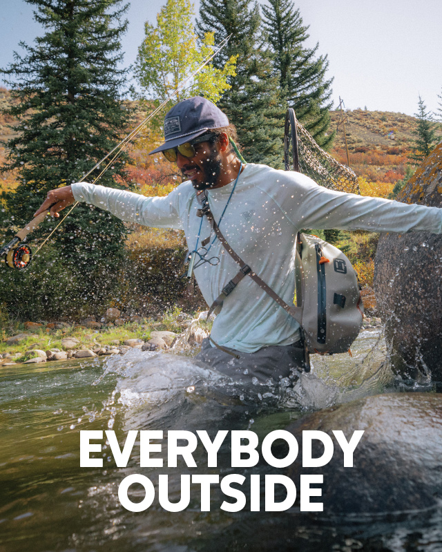 Everybody outside. A man in Columbia gear jumping into a river. 