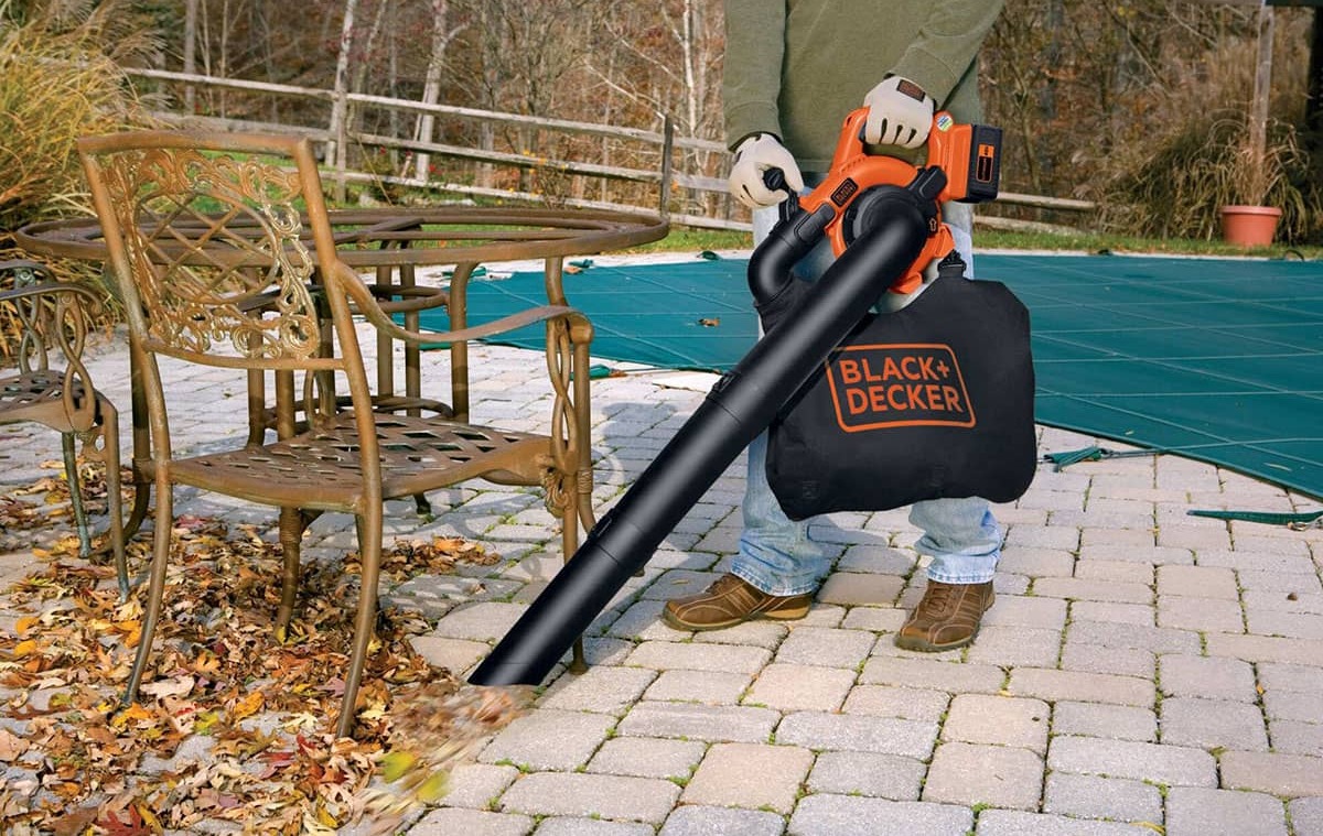 man using leaf blower