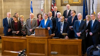 Nebraska Gov. Jim Pillen and Republican state senators at a press conference in the Warner Chamber at the state Capitol, Feb. 12, 2024.