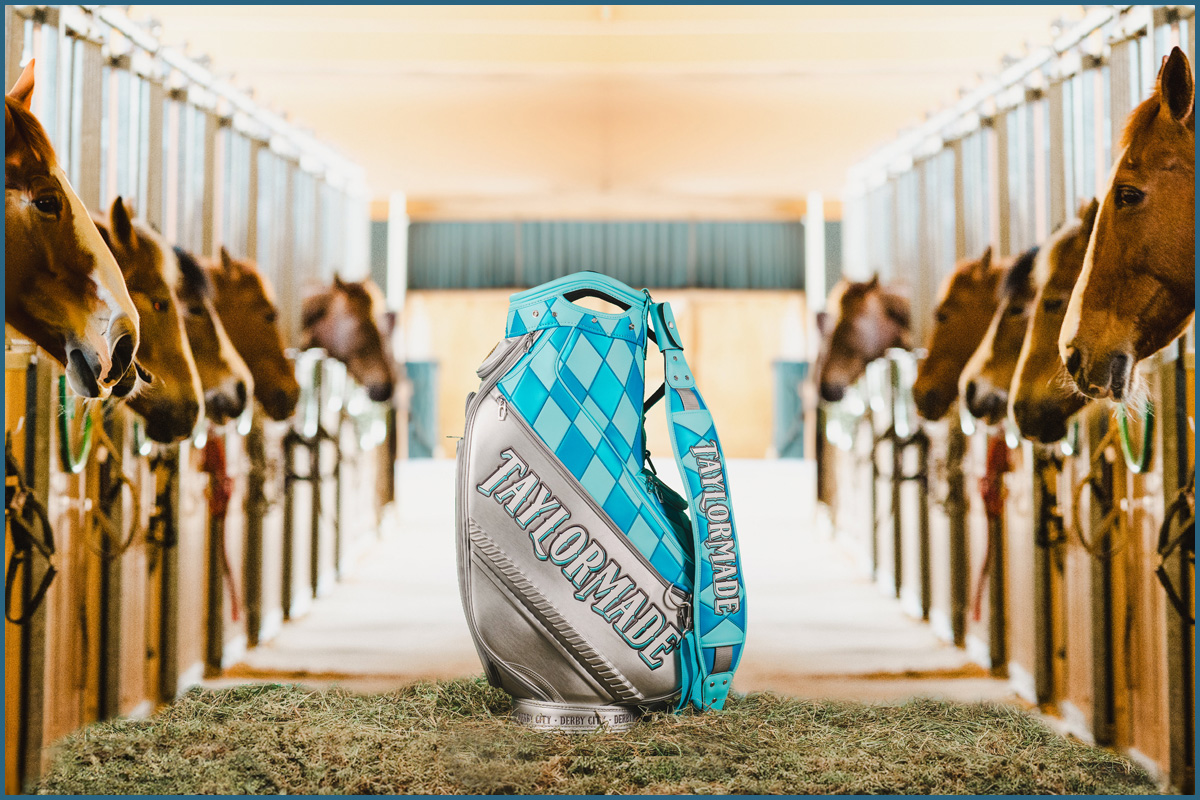 Professional Championship staff bag on hay surrounded by horses