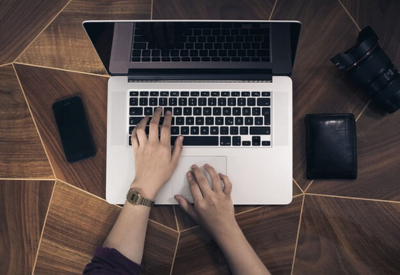 Person typing on a laptop