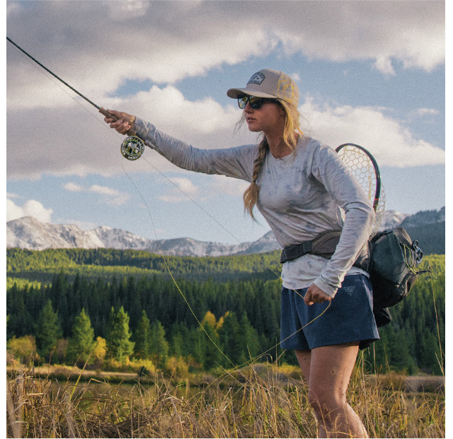 Woman fishing in the Women's PFG Uncharted™ Knit Long Sleeve Shirt