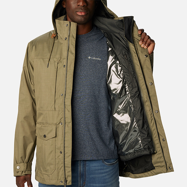 A man showing the warm thermal-reflective lining in the Horizons Pine Interchange Jacket.