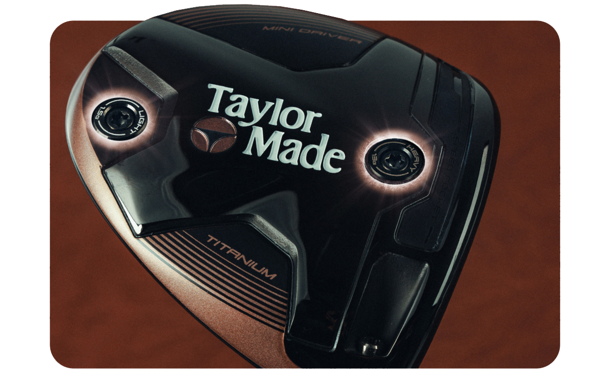 Bottom of the Copper BRNR Mini Driver, showing its retro TaylorMade logo and the adjustable weights