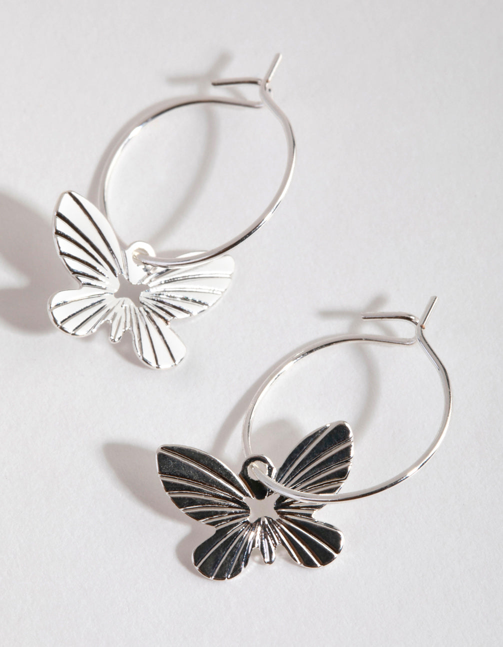 Image of Silver Butterfly Huggie Hoop Earrings