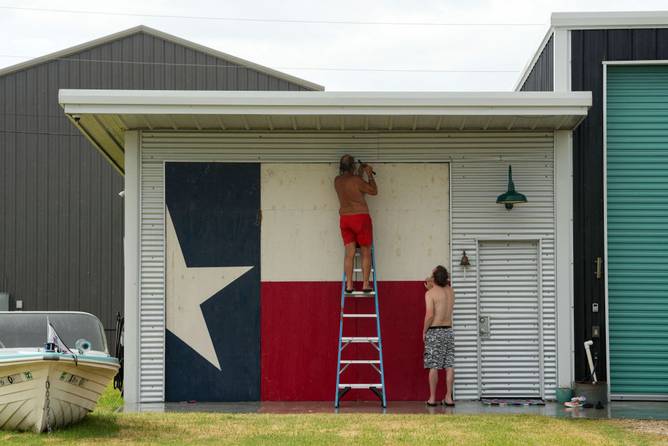 Boarding up a house in Texas ahead of Beryl