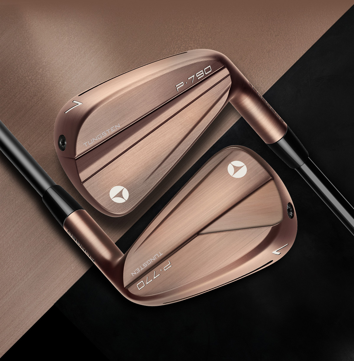 P⋅790 and P⋅770 Copper Irons laid down facing opposite one another on a half copper, half black background