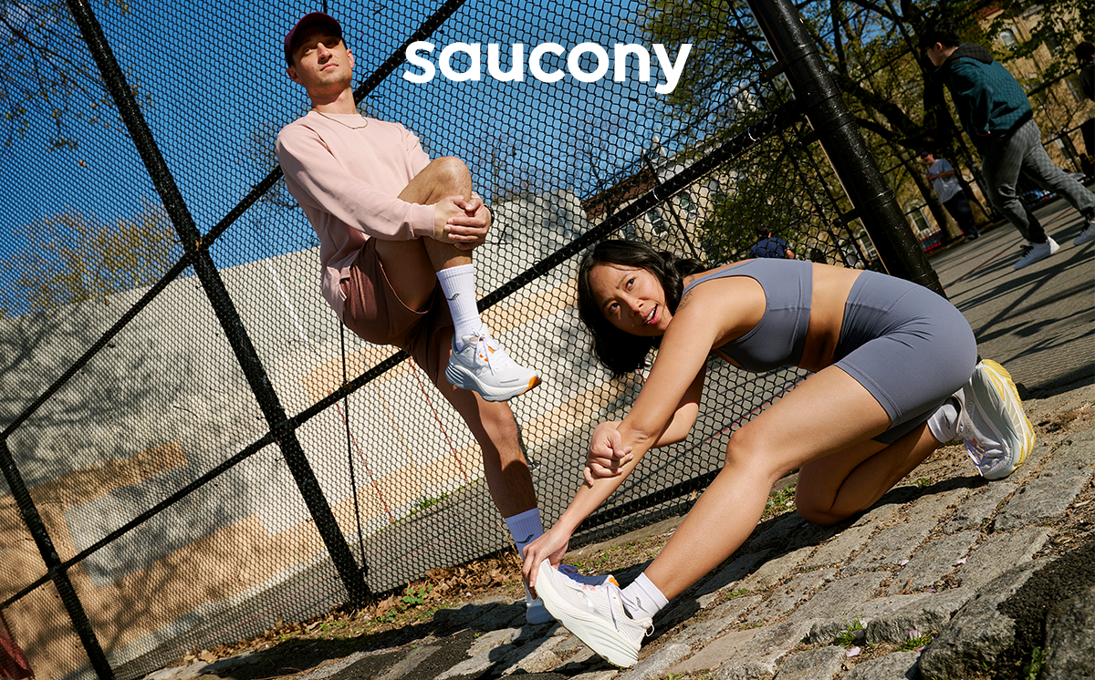 Saucony - Two people stretching while wearing saucony running shoes