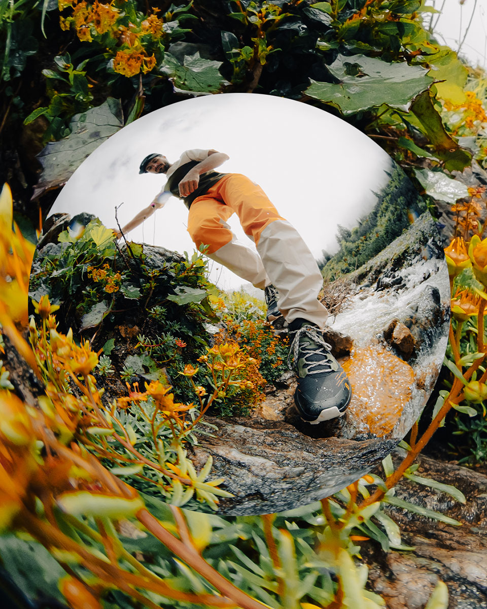 A man hiking with the SCOTT Mountain Wear Collection