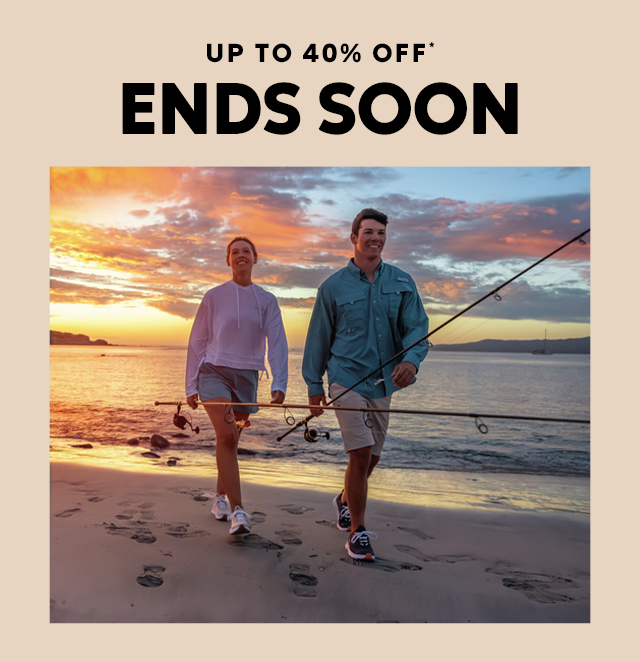 A couple on the beach at sunset with headline Up to forty percent off ends soon. 