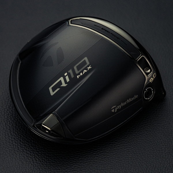 Bottom of the Qi10 Max Black Out Designer Series Driver on a  black leather background