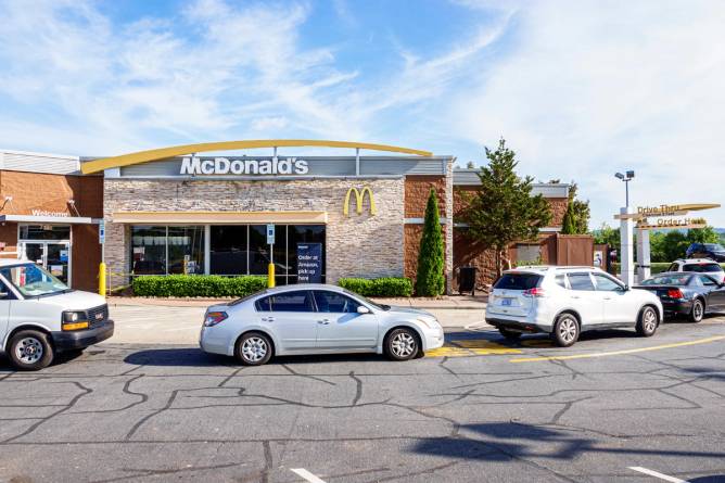 Cars waiting in line at a McDonald's drive thru