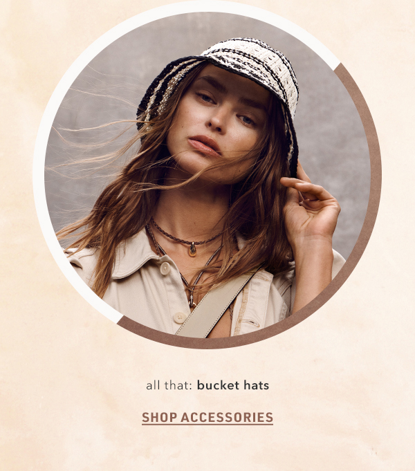 Woman wearing bucket hat. Shop accessories.