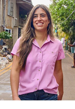 Woman in short sleeve walking in street