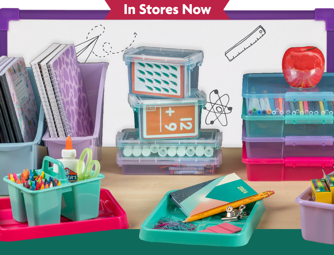 Teacher desk with notebooks, craft supplies, storage containers, and more