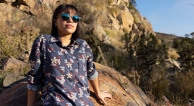 Woman sitting on a rock