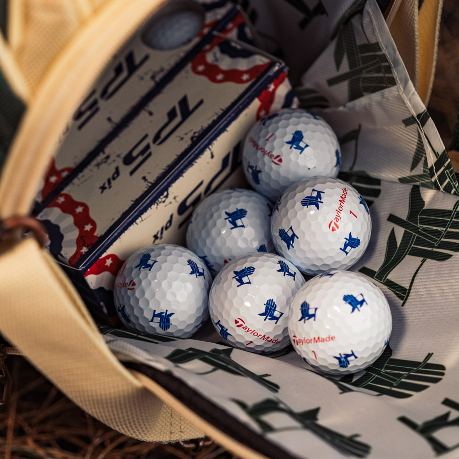 TP5 & TP5x pix Summer Commemorative golf balls inside of the pocket of the staff bag