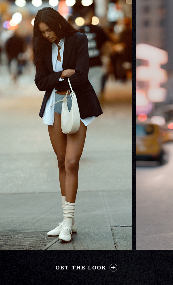 Woman in blazer and light blue button down. Get the look.