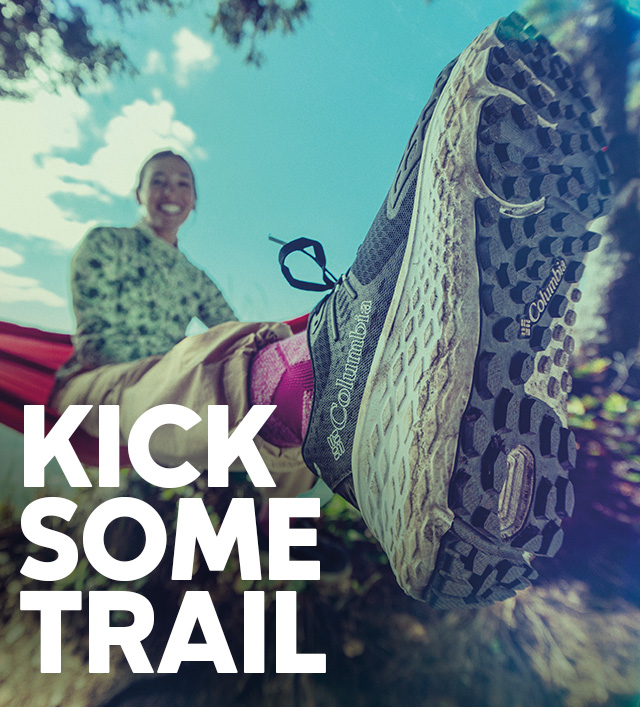 Kick some trail. Close-up of a person wearing Omni-Max hiking shoes. 