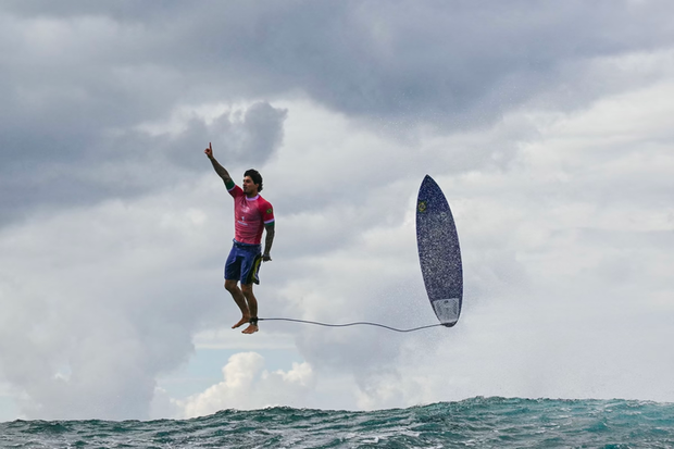 Brazil's Gabriel Medina reacts after getting a large wave in the fifth heat of the men's surfing third round, during the Paris 2024 Olympic Games, in Teahupo'o