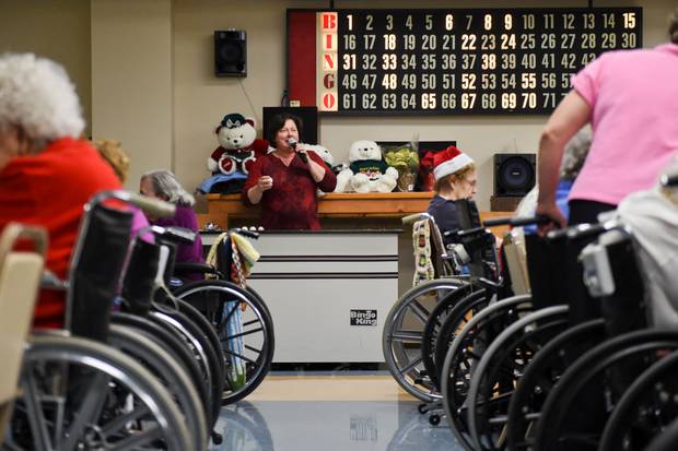 Someone reading out Bingo at a nursing home