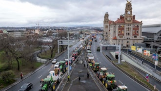 Farmers line their tractors up on a street in Prague, Feb. 19, 2024.