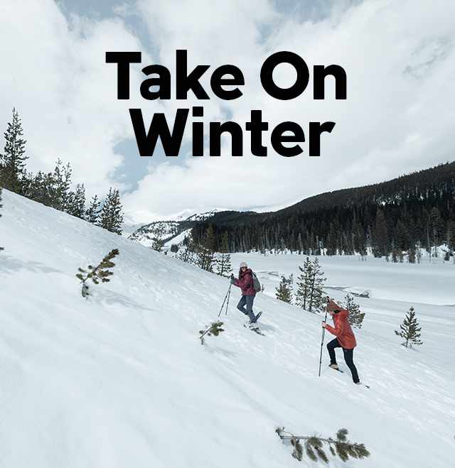 Take on winter. Two women hiking in snow. 