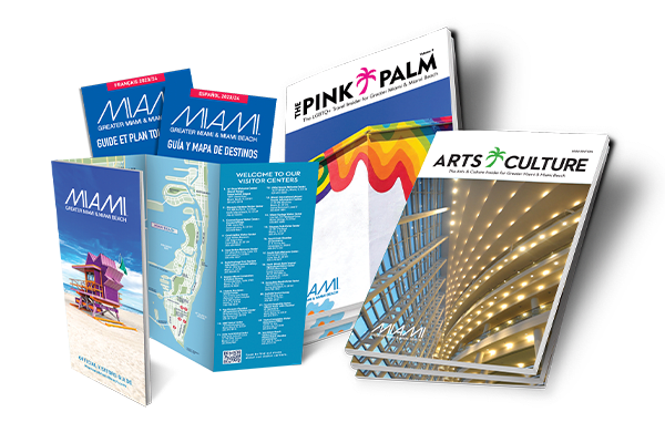 A collage of printed brochures and guides about Miami