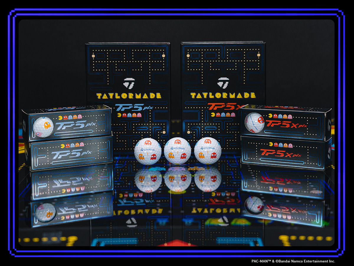 TaylorMade | PacMan TP5 and TP5x Pix golf balls and boxes on a reflective table