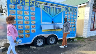 Clemene Bastien and Theslet Benoir outside their Eben-Ezer Haitian food truck in Parksley, Va., Jan. 24, 2024.